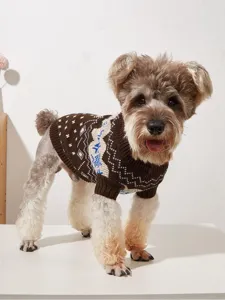 Close-up of cozy brown knit pet sweater with winter snowflake and wave patterns for dogs.