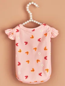 Cute pink pet vest detail showcasing lovely animal and flower print design, soft summer fabric.