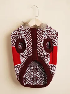 Detailed close-up of cozy knit dog sweater with festive Nordic pattern and faux fur trim.