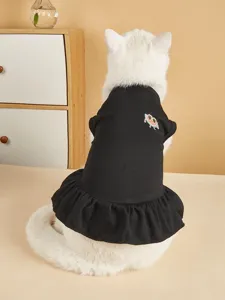 Cute black pet dress for cats and dogs with sweet watermelon embroidery detail, cozy autumn wear.