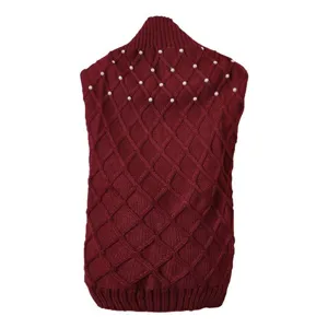 Knitted pet sweater detail showing diamond pattern and pearl embellishment for winter.