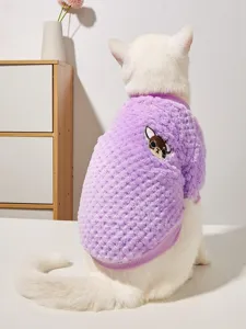 Close-up detail of the soft purple coral fleece pet sweater featuring cute dog embroidery.