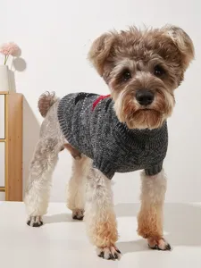 Detailed view of the cozy grey knit dog sweater with geometric pattern on a cute schnauzer.