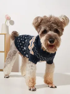 Detailed view of the dark blue knit dog sweater featuring stylish snowflake and wave patterns.