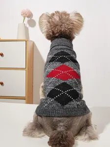 Close-up detail view of a stylish pet sweater featuring a classic argyle diamond knit pattern.