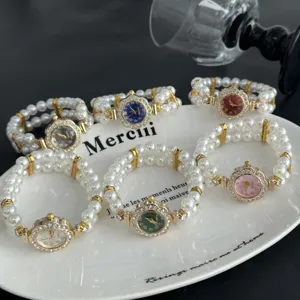 Reloj de pulsera de perlas elásticas con esfera floral de diamantes, elegante.