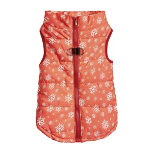 Close-up of the front zipper and dual D-rings on the red winter pet vest with white snowflakes.