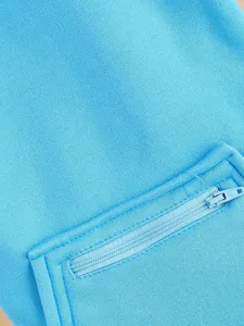 Blue pet hoodie detail shot, solid color dog apparel with a convenient zipper pocket design.