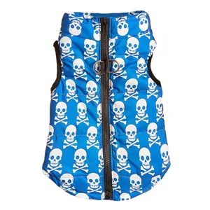 Blue pet puffer vest with white skull print, warm winter dog clothes with leash ring, detail view.