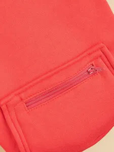 Red pet hoodie detail showing zipper pocket, soft fabric construction for dogs and cats.