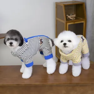 Detailed view of cute pet four-legged jumpsuit with contrast vertical stripes and embroidery.