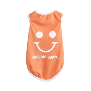 Cute orange summer dog vest with white smiley face and smile print for small pets.