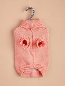 Detailed view of cute knitted pet sweater with high collar design in soft peach color.