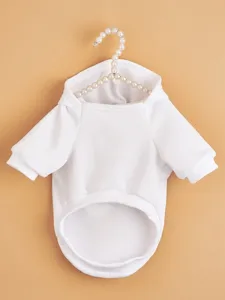 Solid white pet hoodie detail, soft fabric, cozy pet apparel for autumn and winter.