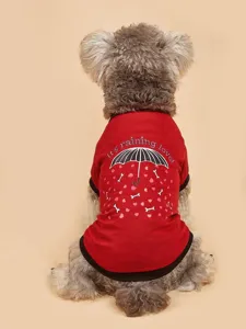 Detailed shot of pet t-shirt with cute umbrella print, soft fabric for small dogs.