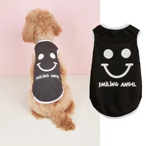 Detailed close-up of black puppy vest featuring white smiley face and stylish letter print.