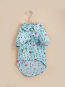 Detailed view of light blue pet shirt with cute owl, leaf and floral print, collar design.