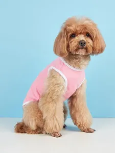Cute pink dog vest detail showing soft breathable fabric and neat white trim for small dogs.