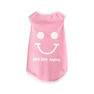 Pink dog vest detail shot, cute smiley face print and white trim for summer pet clothes.