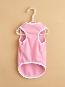 Pink pet vest with white trim, cute dog clothing detail view, comfortable daily wear.