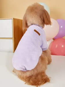Detailed view of soft fleece pet winter clothes in purple with classic label, back shot.