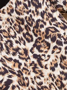 Close-up view of the chic leopard print fleece fabric detail on the pet hoodie sweater.