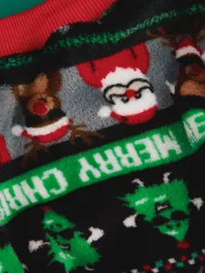 Cozy coral fleece pet winter sweater detail featuring cute Christmas Santa and elk festive design.