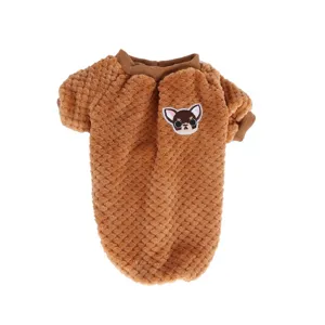 Close-up detail of the brown fleece pet clothes with cute cartoon puppy embroidery patch.