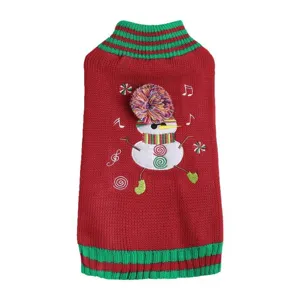 Close-up detail of the red and green knit pet sweater with a cute snowman and colorful pom-pom.