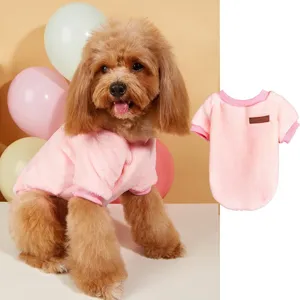 Cute pink fleece pet sweater for dogs and cats, warm winter apparel with classic patch.