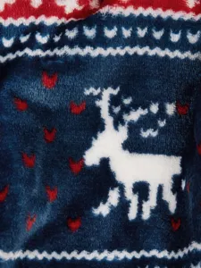 Close-up detail of winter pet fleece clothing featuring cute reindeer and snowflake patterns.