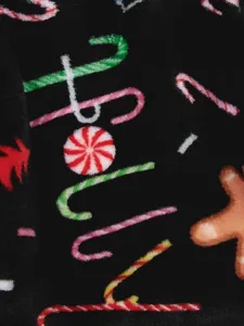 Coral fleece pet clothing detail showing warm Christmas gingerbread man print fabric.