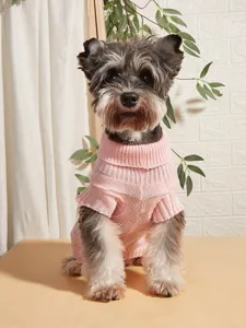 Close-up detail of the pink knitted pet turtleneck sweater, soft warm fabric for small dogs.