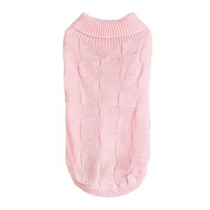 Detailed view of the pink knitted dog sweater featuring a classic checkered pattern and cozy turtleneck collar.