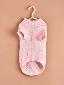 Pink knitted dog sweater detailed view featuring cozy lapel and elastic plaid texture.