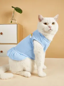 Cute cat dress with rainbow cloud patch detail, soft blue pet apparel for kittens and small dogs.