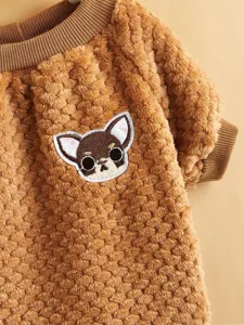 Brown coral fleece pet sweater detail, soft warm dog clothes with cute cartoon puppy embroidery.