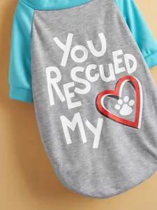 Pet dog t-shirt detail showing colorful raglan sleeves and cute rescue heart graphic.