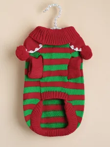 Detailed shot of Christmas pet knit sweater with red and green stripes and cute pom-poms.