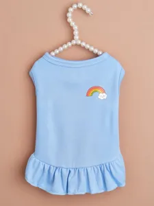 Close up detail of a cute light blue pet dress featuring a sweet rainbow and cloud print.