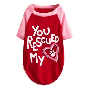 Detailed view of the cute red and pink pet dog t-shirt featuring rescued text and heart paw design.
