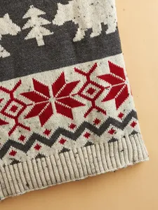 Close-up detail of knitted pet sweater featuring Nordic bear and snowflake pattern winter.
