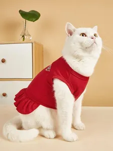 Cute red pet dress for cats and dogs, featuring ruffles and back print, cozy pet apparel.