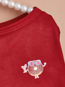 Pet clothes detail red dog dress cute donut print close up shot autumn winter pet apparel