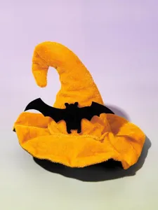 Pet Halloween witch hat detail shot, orange plush hat with black bat decor, festive pet prop.