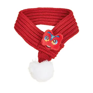 Red knitted pet scarf with plush lion dance decor and white pom-pom, warm winter pet accessory.