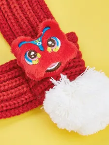 Red knitted pet scarf with 3D lion dance plush design and white pompom for warm winter dog cat