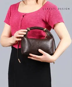 Brown leather shoulder bag for women, elegant dumpling handbag with metal handle for commute