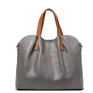 Detailed close-up view of the soft leather tote bag showing fine stitching and hardware.
