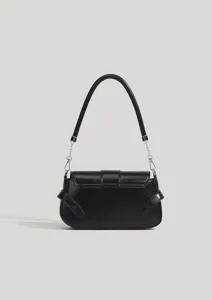 Detailed view of the black leather underarm bag featuring silver chain links and side straps.